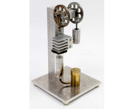 A kit built vertical Stirling Type Vacuum Engine, made by David Bull Wisbech 2014, housed in a glazed display case with burne