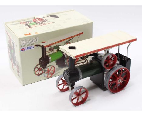 A Mamod Steam Tractor TE1A, green body, white roof, red wheels, the model is dusty from being on display, sold in the origina