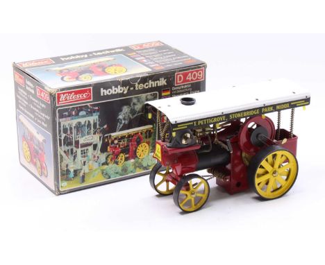 Wilesco D409 Showmans Engine, Live Steam, finished in red and black with corrugated canopy to read "T.Pettigrove, Stonebridge
