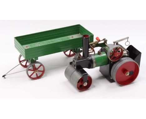 A Mamod spirit fired live steam road roller of usual specification, with matching four wheel trailer