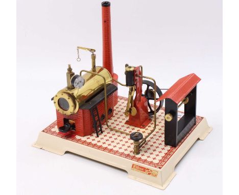 A Wilesco D15 stationary steam plant comprising spirit fired horizontal boiler, powering vertical single cylinder engine with