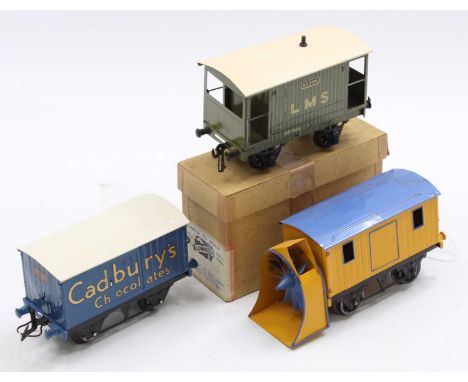 Three goods wagons: Hornby Cadbury Chocolates, total repaint, gloss, blue body, black chassis, white roof. All to an exceptio