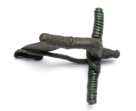 Roman Brooch.  Circa, 2nd-3rd century AD. Copper-alloy, 11.58 g, 37.17 mm. P-shaped bow brooch with wide spring bar and long 