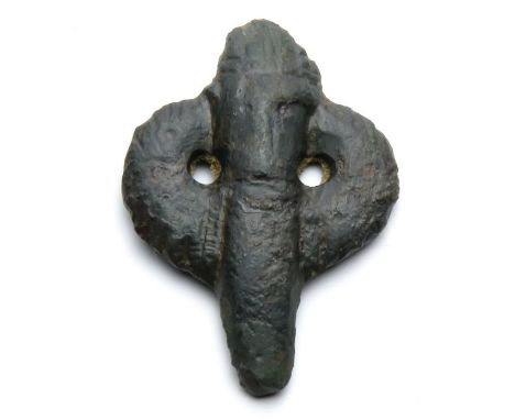 Anglo-Saxon Mount.  Circa 8th-9th century AD. Copper-alloy, 6.70 g, 32.16 mm. A scabbard mount in the stylised form of a helm