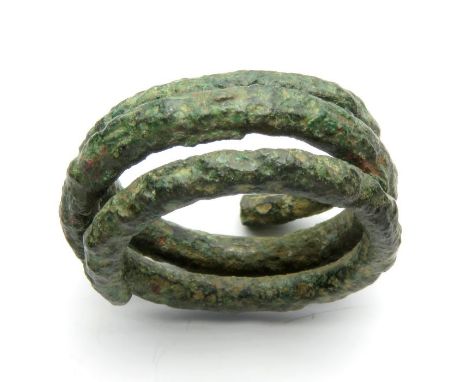 Iron Age Ring.  Circa, 100 BC-100 AD. Copper-alloy, 26mm diameter x 11mm, 12.2g. A bronze coiled or spiral type ring of three