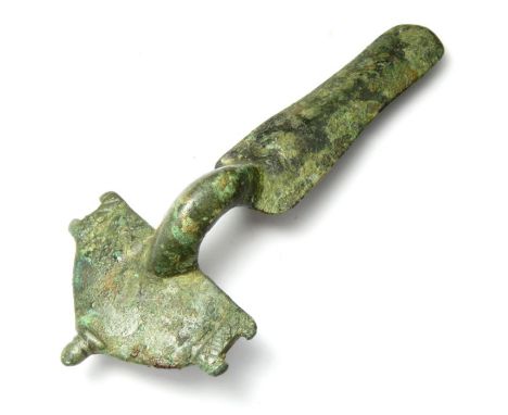 Visigothic Brooch. Circa 6th century AD. Copper-alloy, 98mm x 42mm, 40.8g. A bow type brooch formed of a D-shape head with ce