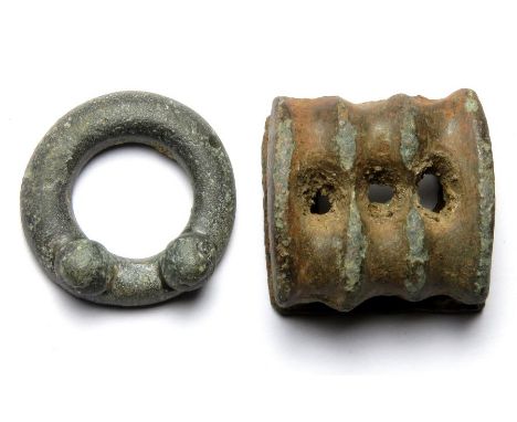 Celtic Group. Circa, 1st century AD. Comprising a very small terret ring and a ribbed type belt fitting.