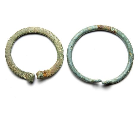 Celtic / Romano-British Brooches. Circa, 1st century BC- 1st century AD. Copper-alloy, 36mm and 32mm. Two penannular brooches