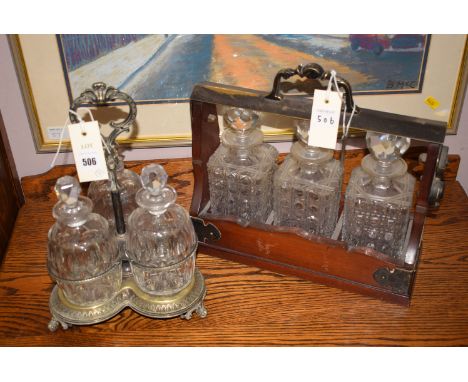 A tantalus containing three hobnail cut glass decanters, held in mahogany case with key; together with a decanter stand conta