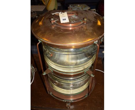 An early 20th Century Japanese brass and copper ship's dual masthead navigation light (converted to electricity).