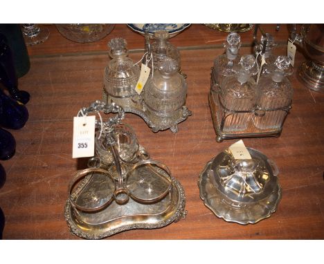 *A four glass decanters with stoppers, fitted Sheffield plated base (damage to decanters); together with three glass decanter