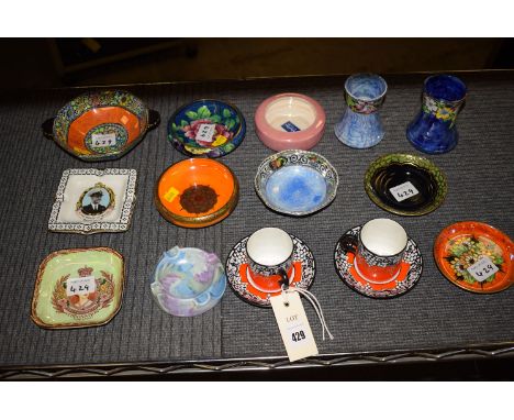 A collection of small Maling ware, to include: a small orange and gold bowl, numbered 3324; two coffee cans and saucers in or