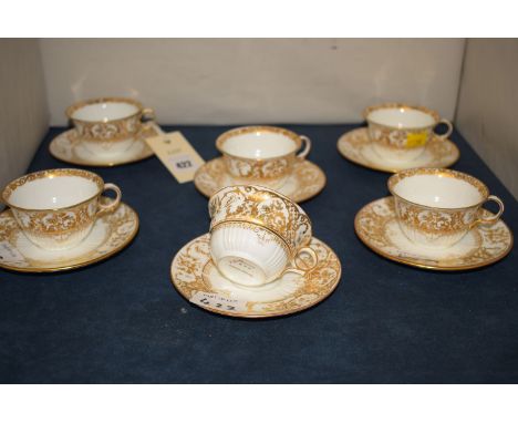 Six Wedgwood cups and saucers with gilt decoration 'Y5527'.
