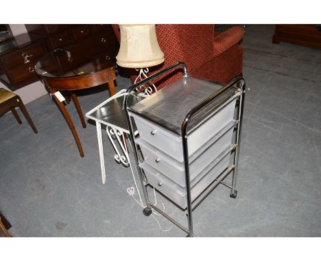 A reproduction mahogany console table; a white painted metal occasional table fitted lights; and a trolley.