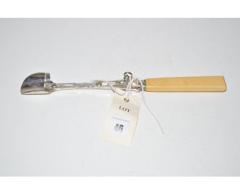 An Edwardian plated metal stilton scoop with thumb push and ivory handle.
