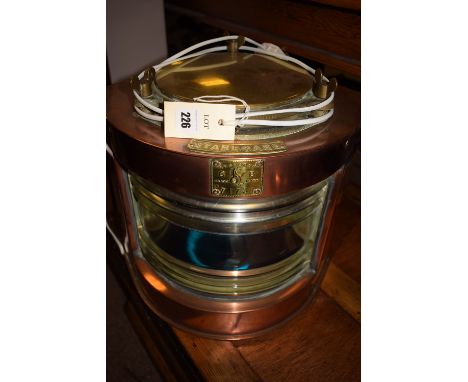 A ship's copper and brass starboard navigation light (converted to electricity).