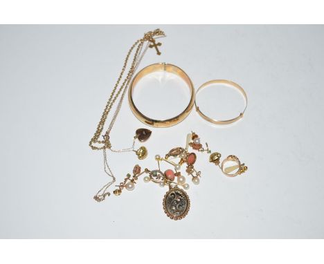 A 9ct. gold bangle; a 9ct. gold pendant; various chains; earrings; etc.
