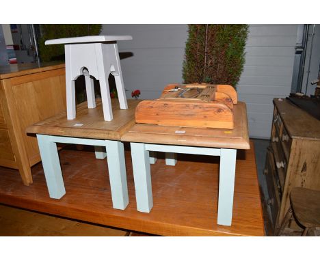 Two modern coffee tables with stripped wooden tops and painted wood bases; a small stool; and a hanging shelf unit.