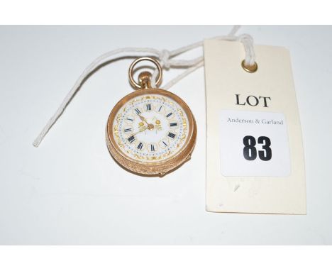 A 14ct. yellow gold open faced fob watch, with decorative roman white enamel dial.