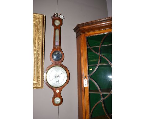A 19th Century mahogany banjo pattern barometer, the silvered dial below convex mirror and thermometer, the case decorated wi