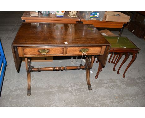 A reproduction burr wood drop leaf sofa table; together with a nest of three tables.