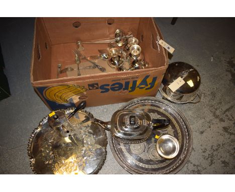 A box of silver plated ware, including: two meat skewers; a teapot; muffin dish; two circular trays; etc.
