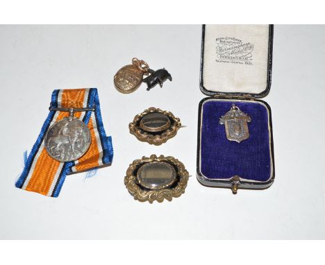 Two giltmetal and black metal mourning brooches; a First World War General Service medal awarded to 252228 Private T. Pattiso