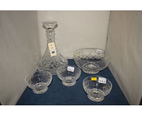 A cut glass bell-shaped decanter; together with a cut glass bowl; and three dessert dishes.