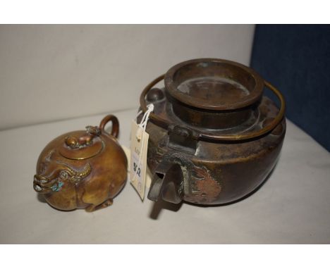 20th Century Chinese brass tea pots, one of ox design with calf finial (signed to base); together with an oil painting of fis