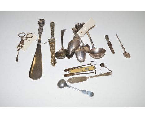 A quantity of silver items, including: Georgian teaspoons; a George III ladle; a white metal mounted knife; a pair of sugar t