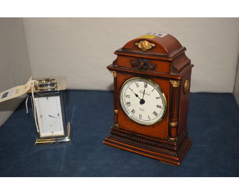 A chrome miniature mantel clock with roman dial; together with another mantel clock by History Craft, with roman dial.  (2)
