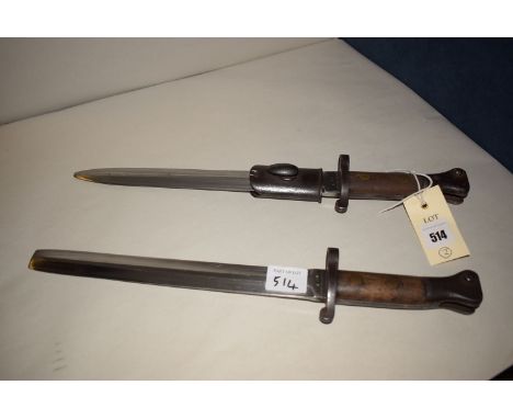 An early 20th Century Wilkinson dagger with wooden handle (most of scabbard missing); together with a similar dagger by Sande