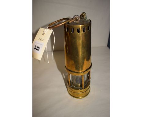 A 19th Century brass thimble top miner's lamp, five brass bars, brass font and locking hasp, by Johnson, Clapham & Morris.