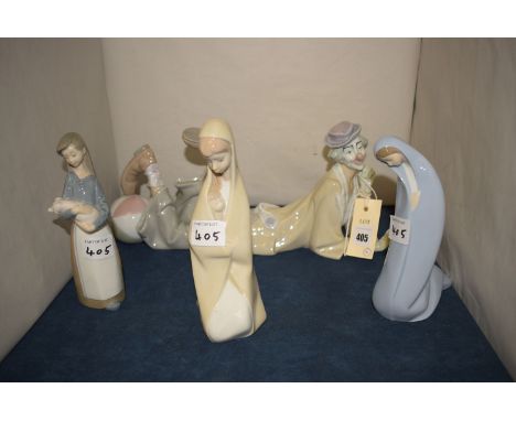 Lladro ware figures, to include: a clown; a girl with piglet; and two others.  (4)