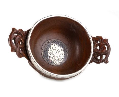 SCOTTISH PROVINCIAL CELTIC REVIVAL SMALL OAK QUAICH, FERGUSON AND MACBEAN - INVERNESS with silver mounted rim and foot and ce