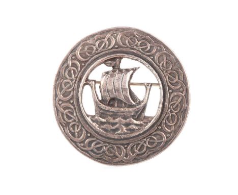 HENDERSON & HORNER BROTHERS - GLASGOW, SCOTTISH SILVER BROOCH,  depicting a central Viking longship within a Celtic knot bord