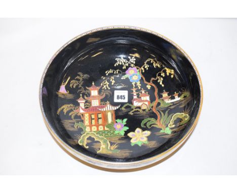 A Maling 'Chinese House, Black Ground Enamel' bowl, mid/late 1920's, pattern no. 3584, 26cms.