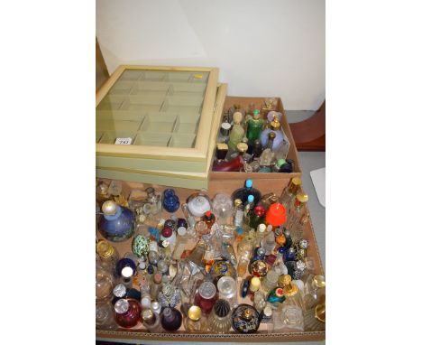 A large collection of perfume bottles some with contents, some without, some glass some are ceramic; a bag full of empty perf