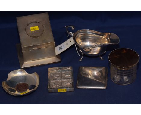 An Edward VIII silver sauce boat, by S. Blankensee & Son Ltd., Birmingham 1936; a George V silver cigarette case, by Carr & S