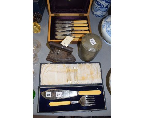 A set of five silver bladed fish knives and matching forks, with ivoril handles, in fitted case (one knife and fork missing);