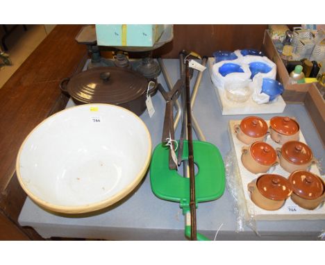 Cast iron kitchen balance and weights; a Le Creuset oval brown enamel casserole and cover; a ceramic mixing bowl; set of cove