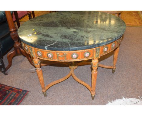 A 20th Century French walnut circular occasional table, the marble top above brass and printed ceramic cartouches, reeded leg