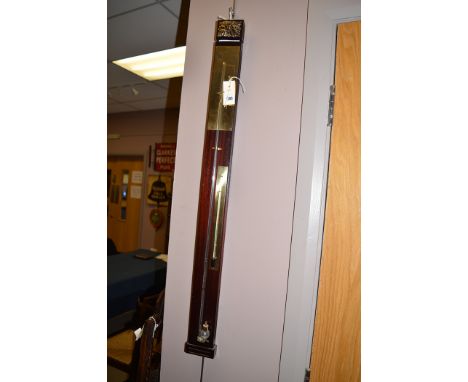 A modern brass and stained wood stick barometer.