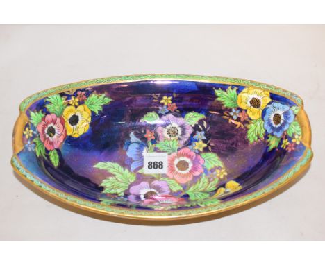 A Maling 'Anemone, Patch Ground' lustre glaze oval bowl, pattern no. 6385, 1936, 28cms long.