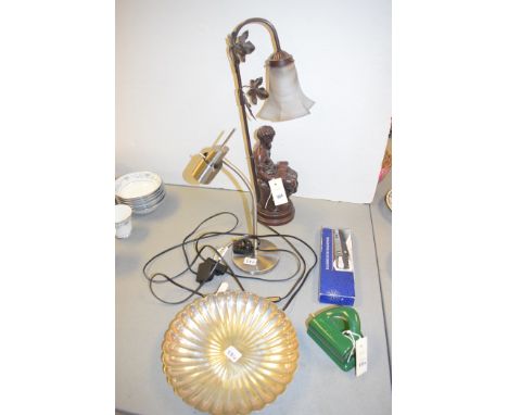 A modern table lamp in the form of a woman reading; a brushed steel table lamp; silver plated lobed dish by Elkington & Co., 