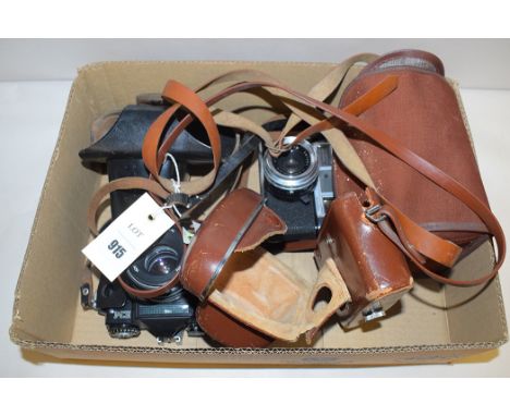 A Zenit camera, no. 79139730; a Yashica Minister, no. 5080473; and a Coronet portrait lens camera.  (3)