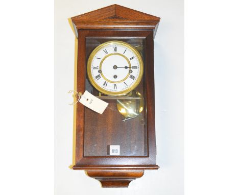 A modern German chiming wall clock, enamel roman dial, in mahogany case.