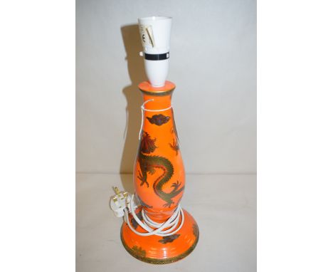 A Maling orange lustre glaze lamp of baluster form, with dragon pattern and gilded decoration, pattern no. 3324, 28.5cms.
