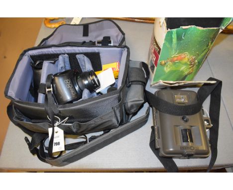 An Olympus OM88 35mm SLR camera; an Olympus lens 50mm 1..2PF; another lens 1..4.5F=75-200mm auto tele zoom lens; accessories 