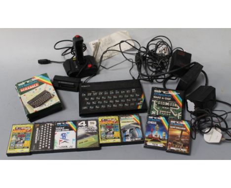 A SINCLAIR 'ZX SPECTRUM' COMPUTER, along with a quantity of games, a joy stick etc.Buyers - for shipping pricing on this lot,